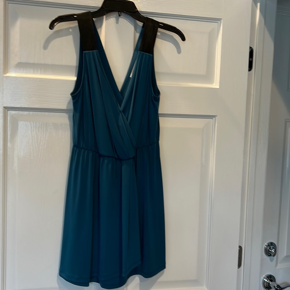 BCBG teal color stretch dress with black straps. V-neck back n front